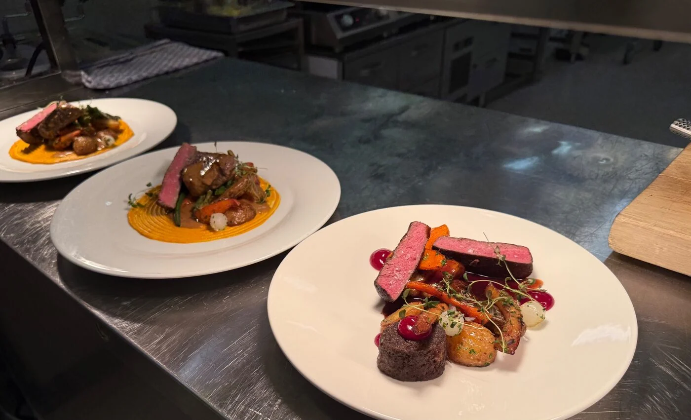 Composed plates ready at the pass in a Finnish kitchen