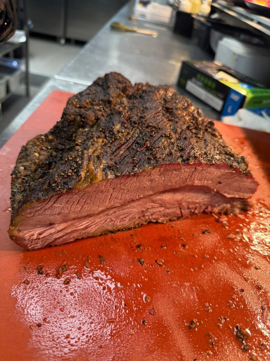 Sliced smoked brisket on a cutting board